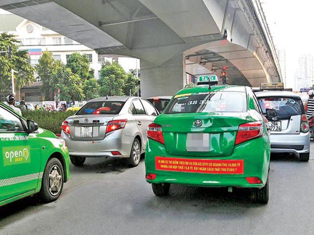 Không sớm định danh, “cuộc chiến” taxi truyển thống và xe công nghệ còn kéo dài - Ảnh 1.