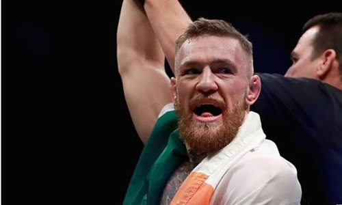 Clip: Conor McGregor quá khích, lao lên sàn MMA đánh... trọng tài - Ảnh 2.