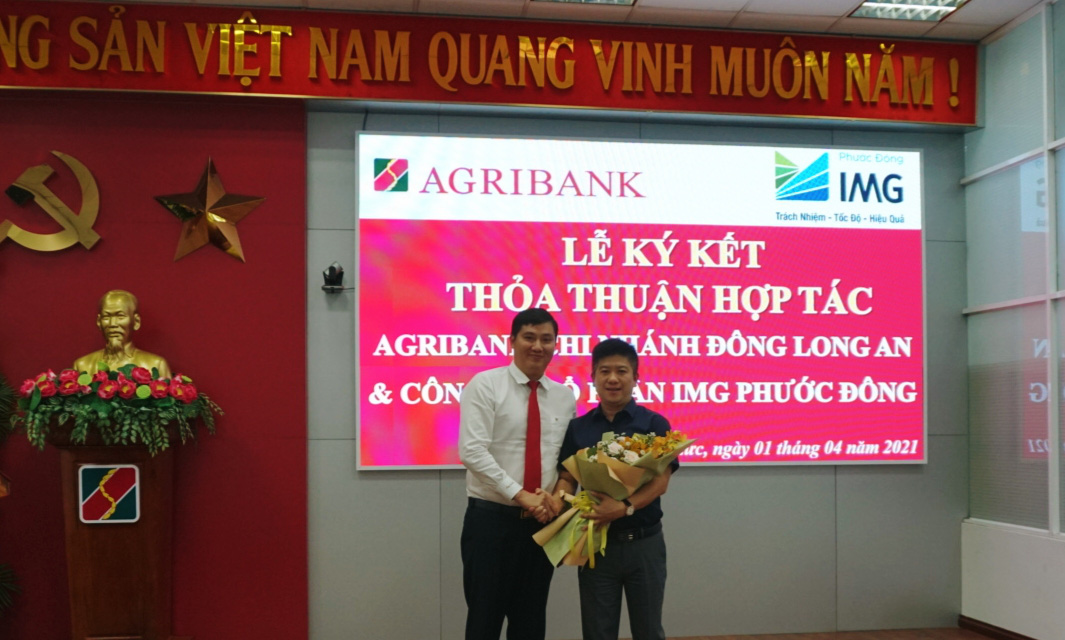 Agribank Chi nhánh Đông Long An ký kết thỏa thuận hợp tác toàn diện với Công ty cổ phần IMG Phước Đông. - Ảnh 2.
