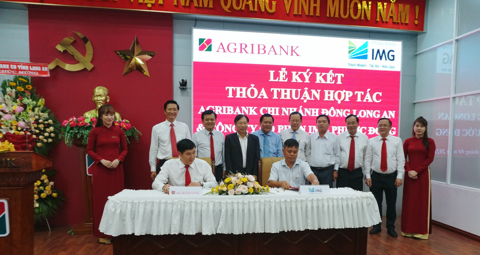 Agribank Chi nhánh Đông Long An ký kết thỏa thuận hợp tác toàn diện với Công ty cổ phần IMG Phước Đông. - Ảnh 1.