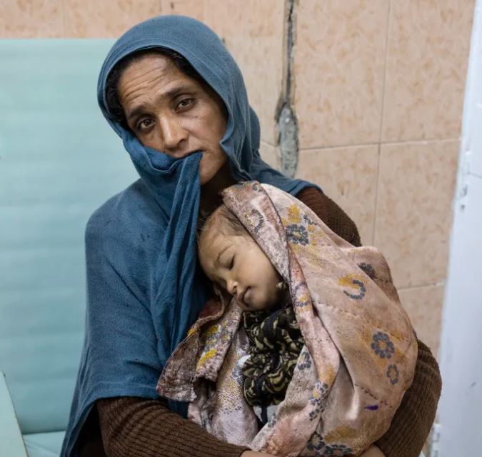 Những hình ảnh 'nhói lòng' trong cuộc khủng hoảng lương thực ở Afghanistan - Ảnh 10.