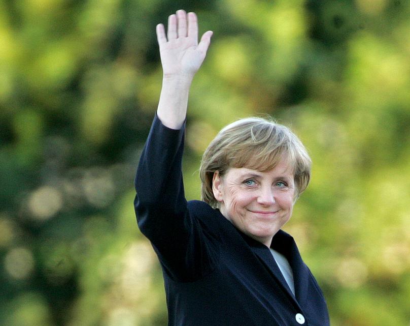 Những hình ảnh đẹp nhất của bà Merkel trong 16 năm cầm quyền - Ảnh 1.