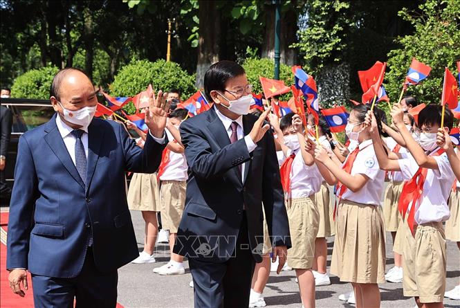 Ảnh: Lễ đón Tổng Bí thư, Chủ tịch nước Lào thăm hữu nghị chính thức Việt Nam - Ảnh 4.