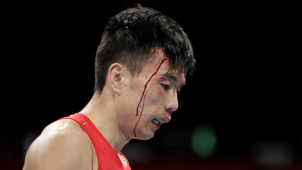 Olympic 2020: Thua chủ nhà, võ sĩ Trung Quốc tố trọng tài thiên vị - Ảnh 2.
