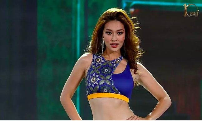 Bán kết Miss Grand International 2022: Đoàn Thiên Ân trình diễn trang phục cắt xẻ gợi cảm - Ảnh 2.