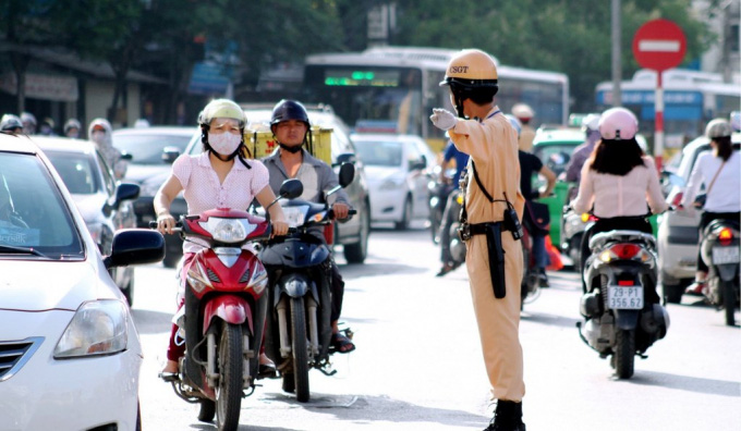 Tra cứu các mức xử phạt vi phạm giao thông phổ biến dịp Tết khi đi xe máy - Ảnh 1.