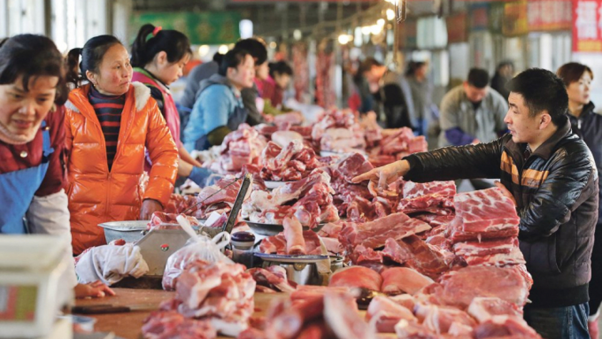 Trung Quốc đang định làm gì với giá thịt lợn? - Ảnh 1.