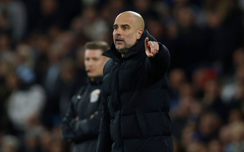 What does coach Guardiola say about Man City’s chances of winning the Premier League?