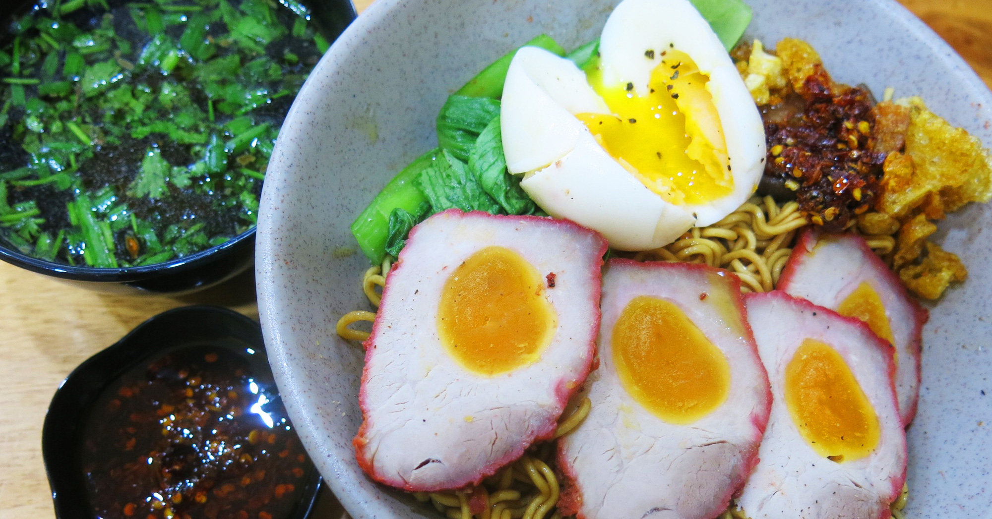 Charming bowl of char siu noodles with salted egg