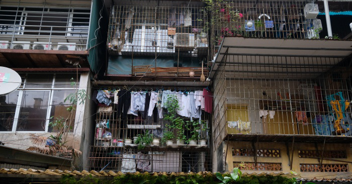 Stunned by the matrix of tiger cages surrounding old apartments in Hanoi