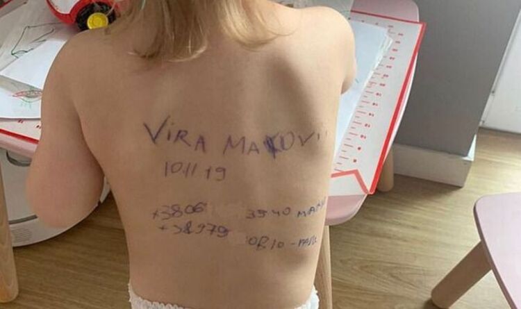 Người mẹ Ukraine viết tên và số điện thoại trên lưng của cô con gái nhỏ phòng lúc bị chia cắt bởi chiến tranh - Ảnh 1.
