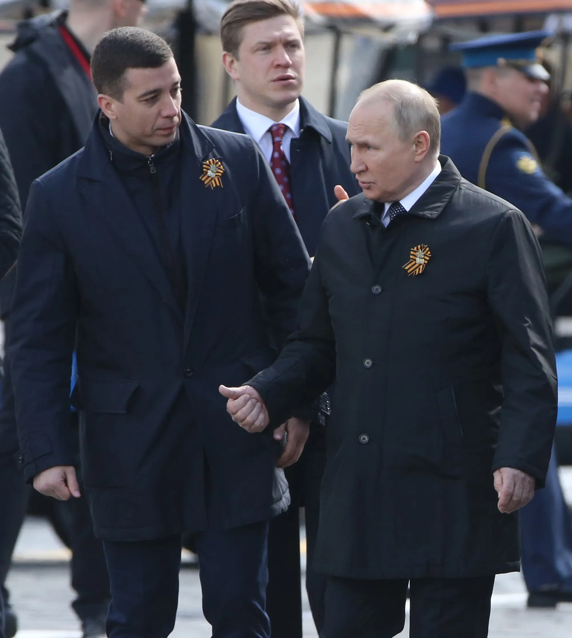 Who is the mysterious young man who talked very closely with President Putin on Victory Day?  - Photo 1.