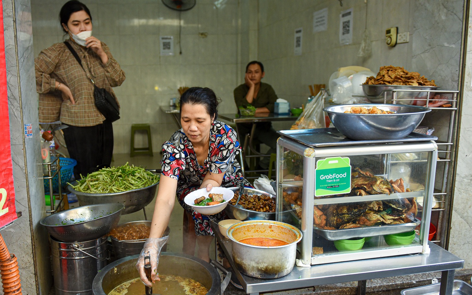 The “unique” fish head noodle shop is busy with people coming in and out all day