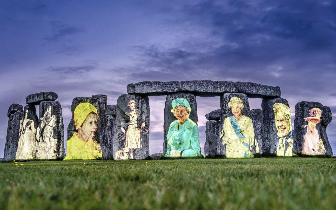 Queen Elizabeth II celebrates Platinum Day with a portrait projected on a mysterious stone circle