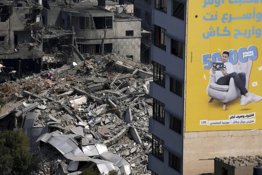 Cảnh tàn phá và đau thương khi hơn 1.100 người thiệt mạng trong xung đột Israel-Hamas - Ảnh 11.