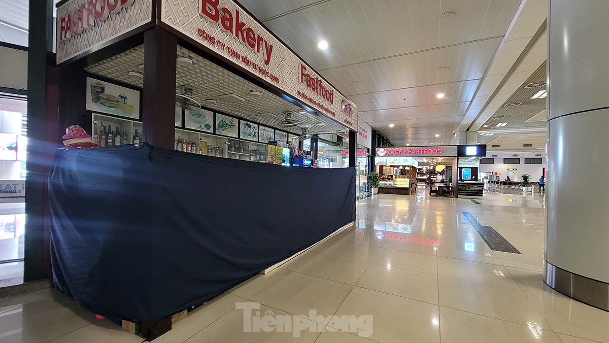 Hình ảnh sân bay Nội Bài &quot;cửa đóng, then cài&quot; tránh bão số 1 đổ bộ - Ảnh 7.