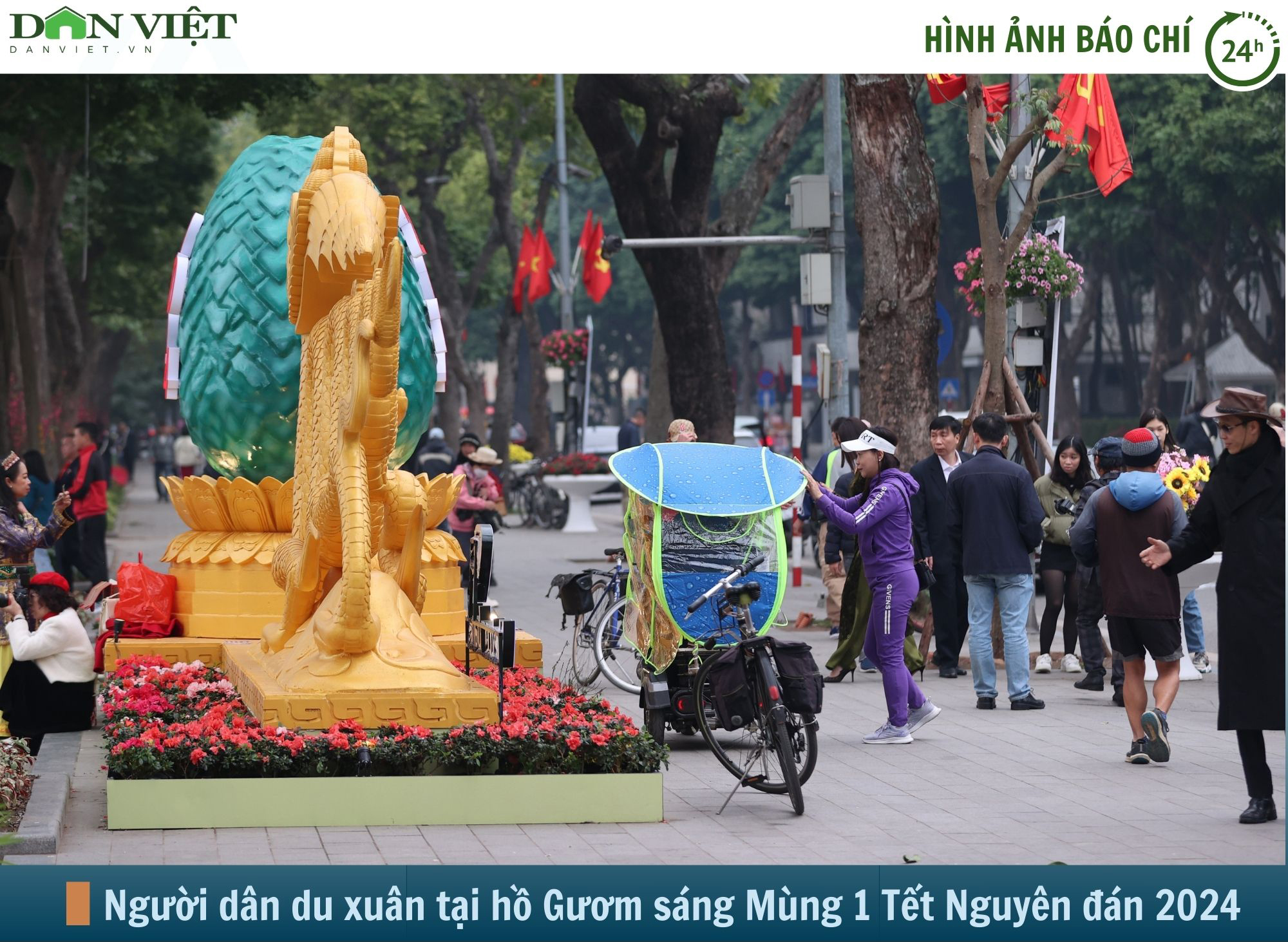 Hình ảnh báo chí 24h: Hồ Gươm đông đúc, người Hà Nội du xuân ngày mùng 1 Tết- Ảnh 1.