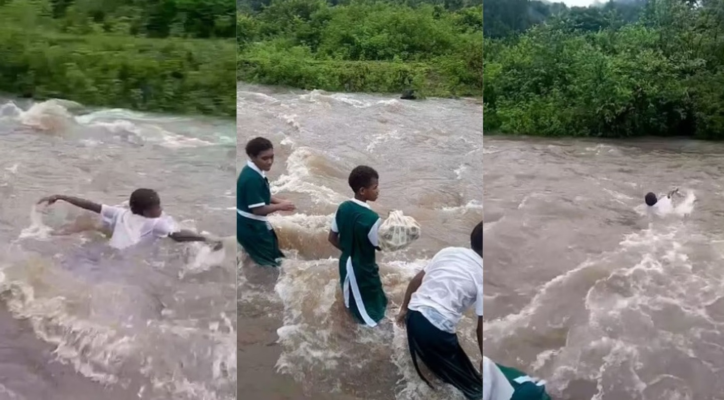 Học sinh Fiji phải bơi qua dòng nước chảy xiết để đến trường- Ảnh 1.