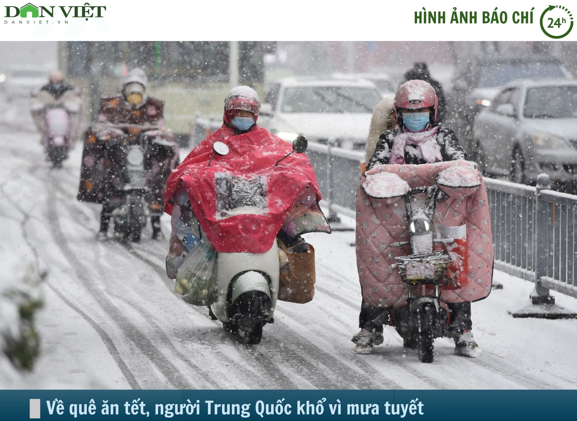 Hình ảnh báo chí 24h: Về quê ăn tết, người Trung Quốc khốn khổ vì mưa tuyết- Ảnh 1.