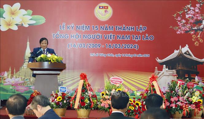 Người Việt tại Lào gắn kết dựng xây đất nước, vun đắp tình hữu nghị- Ảnh 1.