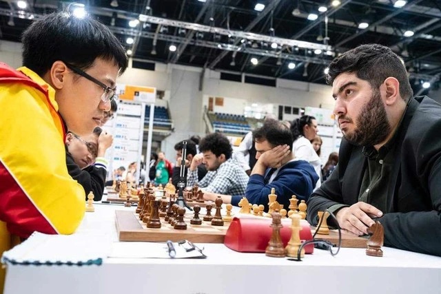 Lê Quang Liêm chuẩn bị đối đầu "Vua cờ" Magnus Carlsen ở vòng 8 Olympiad - Ảnh 1.