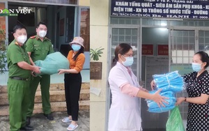 Video: Báo Dân Việt tặng khẩu trang, đồ bảo hộ, kính chắn giọt bắn cho công an và nhân viên y tế