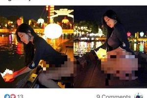 Dân mạng xôn xao hình ảnh nữ du khách nước ngoài lộ vòng ba phản cảm khi thả hoa đăng tại Hội An