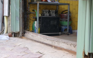 Dân Hà Nội tìm cách chống nước ngập vào nhà khi đón bão số 1
