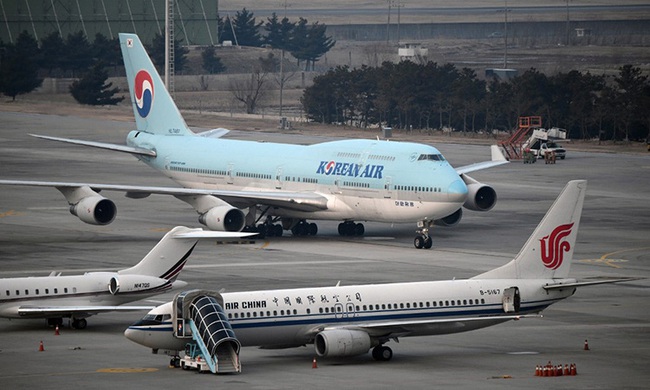 29 hãng hàng không toàn cầu ngừng bay tới Trung Quốc - Ảnh 1.