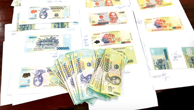 Đồng Nai: Băng nhóm cắt dán sản xuất lưu hành tiền giả mệnh giá 100.000 - 500.000 đồng sa lưới - Ảnh 1.