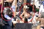 Đi biển với bồ trẻ, HLV Wenger chăm chú nhìn cô gái ngực trần