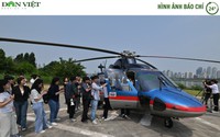 Hình ảnh báo chí 24h: Phóng viên xếp hàng trải nghiệm "taxi bay" ở Hàn Quốc
