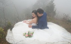 Cô dâu mặc váy cưới vai trần chụp ảnh trên đỉnh Ô Quý Hồ băng giá