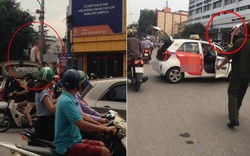 Tài xế taxi leo lên nóc xe "ăn vạ" khi bị cảnh sát dừng xe