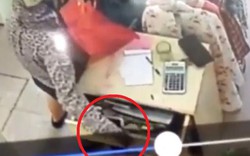 Clip: "Nữ quái" 3 lần mở ngăn tủ trộm điện thoại trong shop quần áo