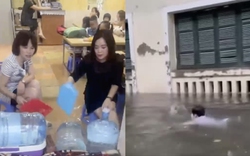 Hà Nội mưa ngập các trường học: Học sinh tung tăng bơi lội dưới sân, cô giáo ngồi tát nước
