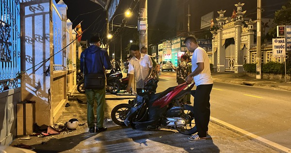 The male student lies motionless on the sidewalk, the scene has a long blood stain, the motorbike is broken