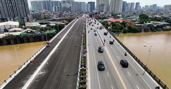 After the opening ceremony, how is Vinh Tuy Bridge phase 2 divided?